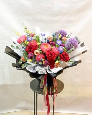 peony coral charm agaphanthus tulip ranunculus carnation rose arrangement for birthday or anniversary